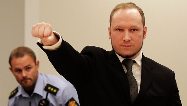 Anders Behring Breivik, makes a salute after arriving in the court room at a courthouse in Oslo, August 2012. - Sputnik International