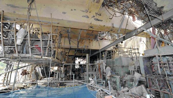 The inside of the tsunami-crippled No. 4 reactor building is seen during a press tour at Tokyo Electric Power Co.'s (TEPCO) Fukushima Dai-ichi nuclear power plant in Okuma, Fukushima Prefecture, Japan, Saturday, May 26, 2012. - Sputnik International