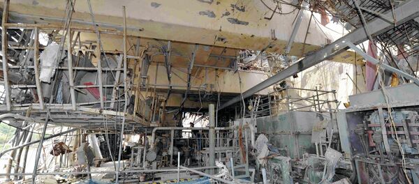 The inside of the tsunami-crippled No. 4 reactor building is seen during a press tour at Tokyo Electric Power Co.'s (TEPCO) Fukushima Dai-ichi nuclear power plant in Okuma, Fukushima Prefecture, Japan, Saturday, May 26, 2012. - Sputnik International