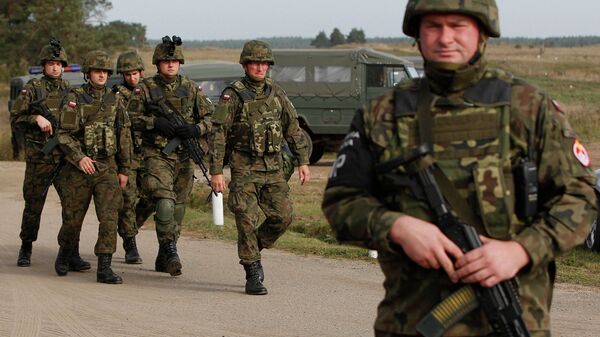 Troops from Poland march during an exercise in Bemowo Piskie near Orzysz, in northeastern Poland. File photo - Sputnik International