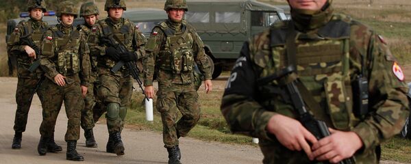 Troops from Poland march during an exercise in Bemowo Piskie near Orzysz, in northeastern Poland. File photo - Sputnik International