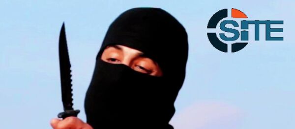 A masked, black-clad militant, who has been identified by the Washington Post newspaper as a Briton named Mohammed Emwazi, brandishes a knife in this still image from a 2014 video obtained from SITE Intel Group February 26, 2015. A masked, black-clad militant, who has been identified by the Washington Post newspaper as a Briton named Mohammed Emwazi, brandishes a knife in this still image from a 2014 video obtained from SITE Intel Group February 26, 2015. - Sputnik International