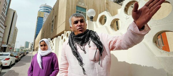 Human rights activist Nabeel Rajab (R) gestures as he walks with his daughter Malak Rajab to attend his appeal hearing at court in Manama, February 11, 2015 Human rights activist Nabeel Rajab (R) gestures as he walks with his daughter Malak Rajab to attend his appeal hearing at court in Manama, February 11, 2015 - Sputnik International
