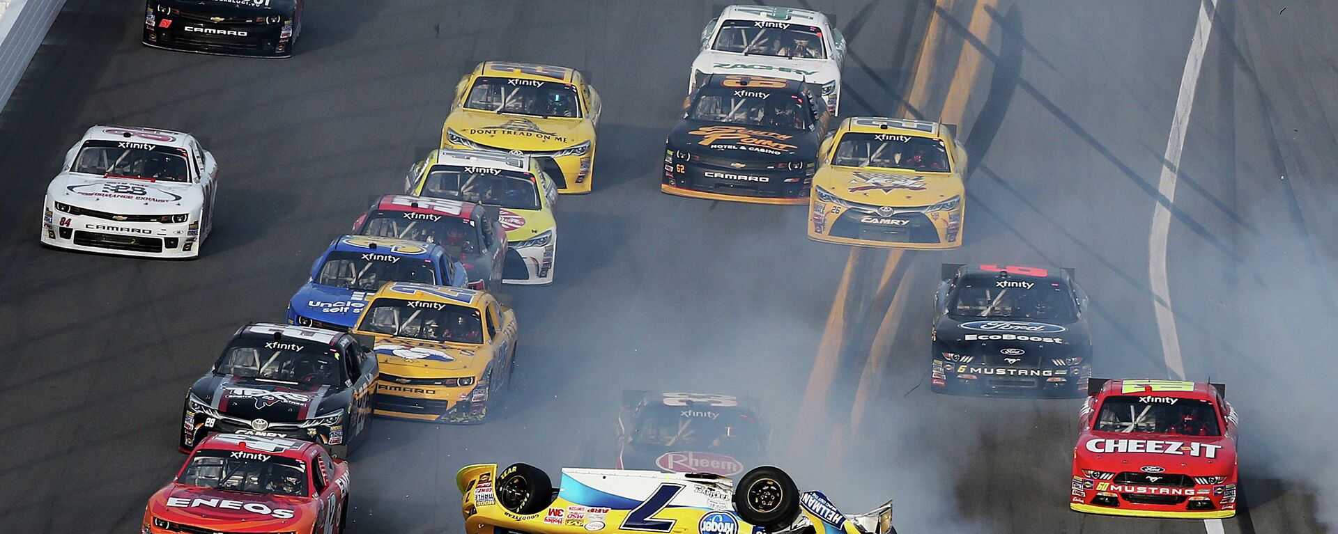 Regan Smith, driver of the #7 Hellmann's Chevrolet, flips over during an on-track incident during the NASCAR XFINITY Series Alert Today Florida 300 at Daytona International Speedway on February 21, 2015 in Daytona Beach, Florida - Sputnik International, 1920, 20.12.2022