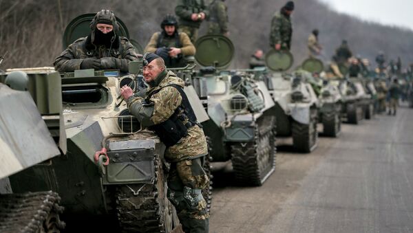 Members of the Ukrainian armed forces and armoured personnel carriers are seen preparing to move as they pull back from Debaltseve region, near Artemivsk - Sputnik International