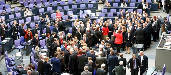 German deputies cast their vote on the approval to extend Greece's bailout, during a session of the Bundestag, the lower house of parliament, in Berlin February 27, 2015. German deputies cast their vote on the approval to extend Greece's bailout, during a session of the Bundestag, the lower house of parliament, in Berlin February 27, 2015. - Sputnik International