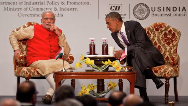 U.S. President Barack Obama, right leans towards Indian Prime Minister Narendra Modi to talk to him during the India-U.S business summit in New Delhi, India, Monday, Jan. 26, 2015. - Sputnik International