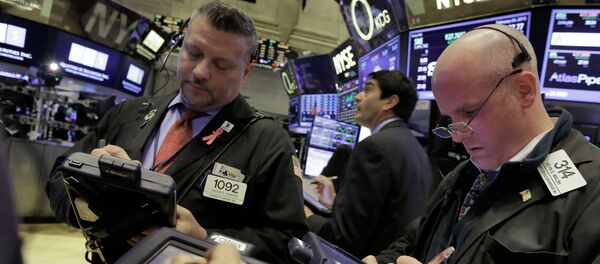 Traders work on the floor of the New York Stock Exchange Traders work on the floor of the New York Stock Exchange - Sputnik International