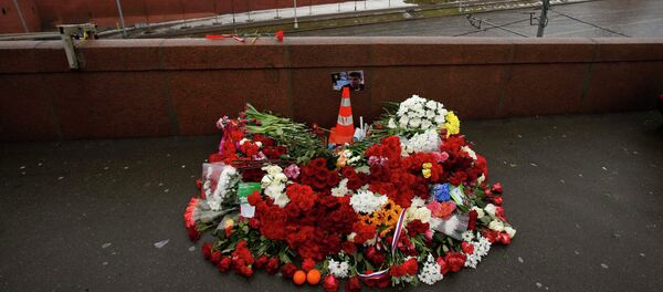 A photo, candles and flowers are placed at the site where Boris Nemtsov was shot dead, near the Kremlin in central Moscow, February 28, 2015. A photo, candles and flowers are placed at the site where Boris Nemtsov was shot dead, near the Kremlin in central Moscow, February 28, 2015. - Sputnik International