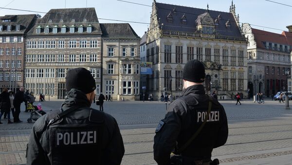 Policemen patrol on the market place in front of the city hall of Bremen, northwestern Germany, on February 28, 2015. Bremen police have specifically warned about Islamic terrorists at large in the Hanseatic city. - Sputnik International