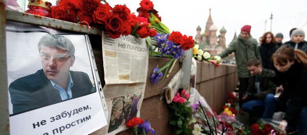 People gather at the site where Boris Nemtsov was recently murdered, with St. Basil's Cathedral seen in the background, in central Moscow, February 28, 2015. People gather at the site where Boris Nemtsov was recently murdered, with St. Basil's Cathedral seen in the background, in central Moscow, February 28, 2015. - Sputnik International