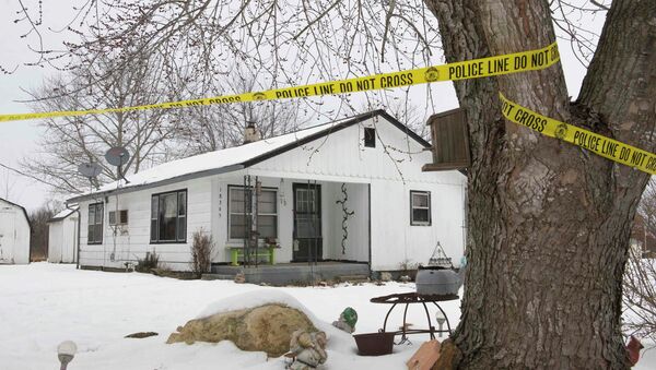 Police tape surrounds one of the crime scenes where gunman, Joseph Jesse Aldridge, killed seven people on Thursday night in Tyrone, Missouri - Sputnik International