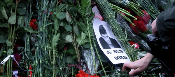 People place flowers on February 28, 2015 at the spot, where Russian opposition leader Boris Nemtsov was shot dead, near Saint-Basil's Cathedral, in the center of Moscow People place flowers on February 28, 2015 at the spot, where Russian opposition leader Boris Nemtsov was shot dead, near Saint-Basil's Cathedral, in the center of Moscow - Sputnik International