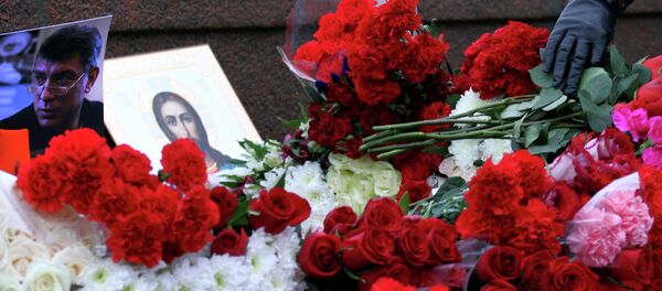 People place flowers on February 28, 2015 at the spot, where Russian opposition leader Boris Nemtsov was shot dead, near Saint-Basil's Cathedral, in the center of Moscow. People place flowers on February 28, 2015 at the spot, where Russian opposition leader Boris Nemtsov was shot dead, near Saint-Basil's Cathedral, in the center of Moscow. - Sputnik International