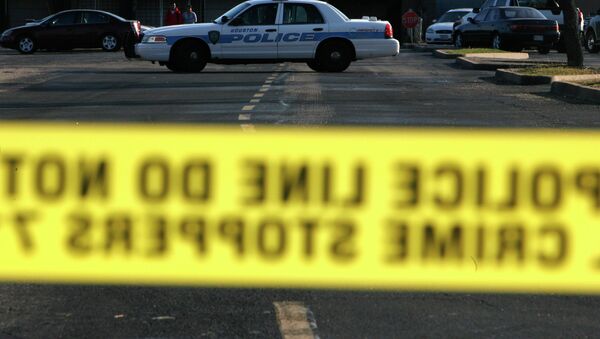 In this 2008 file photo, police taped off a portion of a parking lot behind Sharpstown Mall in Houston. - Sputnik International