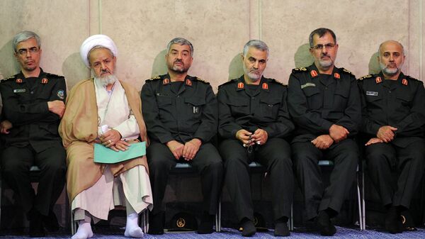 Gen. Qasem Soleimani, third right, sits next to the commander of the Revolutionary Guard, Mohammad Ali Jafari, third left, in a meeting of the commanders of the Revolutionary Guard with Supreme Leader Ayatollah Ali Khamenei in Tehran, Iran.  - Sputnik International