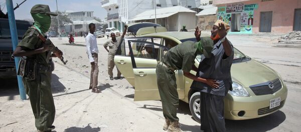 A man is questioned and searched during random vehicle check as part of an operation by Somali security forces against suspected members of the militant group al-Shabab in the capital Mogadishu, Somalia. File photo A man is questioned and searched during random vehicle check as part of an operation by Somali security forces against suspected members of the militant group al-Shabab in the capital Mogadishu, Somalia. File photo - Sputnik International