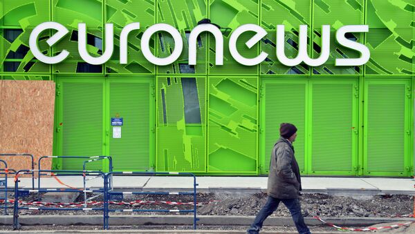 A photo taken on February 6, 2014 shows a man walking past the Euronews building in Lyon's new Confluence district - Sputnik International