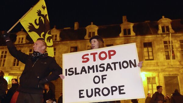 Members of the Belgian branch of Germany's anti-Islam group, PEGIDA (Patriotic Europeans Against the Islamisation of the West), take part in a demonstration in Antwerp - Sputnik International
