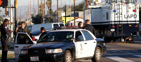 Los Angeles police officers investigate a shooting in South Central Los Angles on Monday, Dec. 29, 2014 Los Angeles police officers investigate a shooting in South Central Los Angles on Monday, Dec. 29, 2014 - Sputnik International