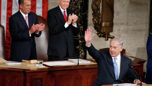 Israeli Prime Minister Benjamin Netanyahu waves as he steps to the podium prior to speaking before a joint meeting of Congress on Capitol Hill. - Sputnik International