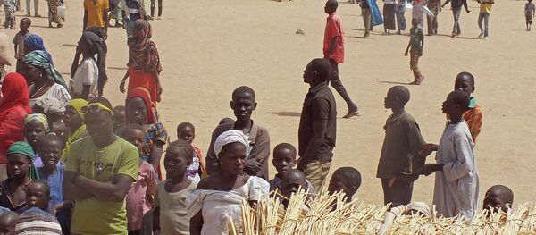 In this photo taken on Wednesday, Feb. 25, 2015, refugees that fled their homes due to violence from the Islamic extremists group Boko Haram inside a refugee camp in Minawao, Cameroon - Sputnik International