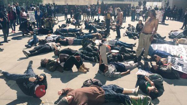 Many demonstrated staged a ‘die-in’ in front of the building to show solidarity for “Africa.” - Sputnik International