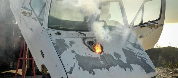 Lockheed Martin ATHENA laser weapon system defeats a truck target by disabling the engine, demonstrating its military effectiveness against enemy ground vehicles - Sputnik International