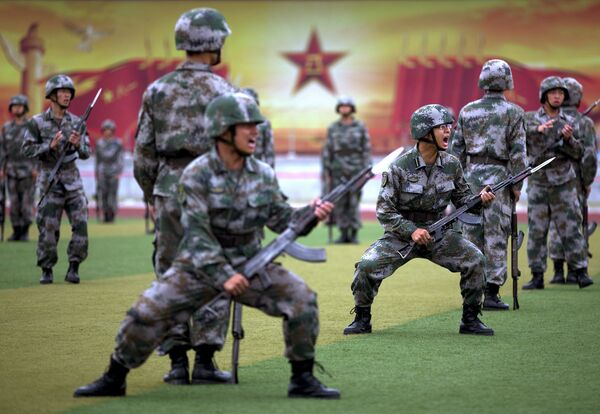 Chinese People's Liberation Army cadets shout as they take part in a bayonet drills at the PLA's Armoured Forces Engineering Academy Base, on the outskirt of Beijing, China - Sputnik International