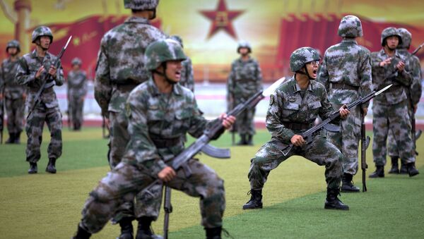Chinese People's Liberation Army cadets shout as they take part in a bayonet drills at the PLA's Armoured Forces Engineering Academy Base, on the outskirt of Beijing, China - Sputnik International