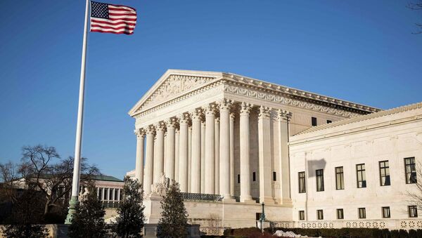 The U.S. flag flutters near the Supreme Court in Washington March 2, 2015. The Supreme Court will hear King v. Burwell - Sputnik International