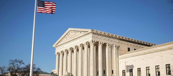 The US flag flutters near the Supreme Court in Washington March 2, 2015. The Supreme Court will hear King v. Burwell The US flag flutters near the Supreme Court in Washington March 2, 2015. The Supreme Court will hear King v. Burwell - Sputnik International