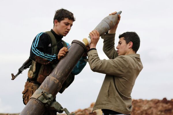 Members of al Qaeda's Nusra Front prepare to fire a mortar towards forces loyal to Syria's President Bashar al-Assad in al-Mallah farms, north of Aleppo, February 18, 2015 Members of al Qaeda's Nusra Front prepare to fire a mortar towards forces loyal to Syria's President Bashar al-Assad in al-Mallah farms, north of Aleppo, February 18, 2015 - Sputnik International