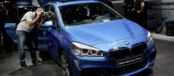 Journalists take pictures of the BMW 220i Gran Tourer during the first press day of the Geneva International Motor Show Journalists take pictures of the BMW 220i Gran Tourer during the first press day of the Geneva International Motor Show - Sputnik International