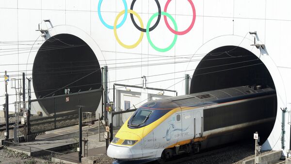 Olympic Rings marking the London 2012 Olympics Games are painted on the entrance to the Channel Tunnel as a Eurostar high-speed train travels through, before arriving at the Eurotunnel terminal in Coquelles, near Calais, northern France - Sputnik International