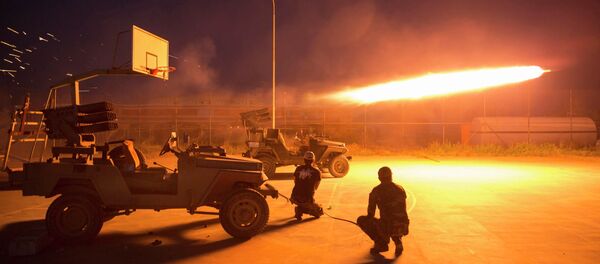 Shi'ite fighters fire a rocket during clashes with Islamic State militants in Salahuddin province March 1, 2015 Shi'ite fighters fire a rocket during clashes with Islamic State militants in Salahuddin province March 1, 2015 - Sputnik International