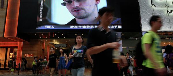 A TV screen at a shopping mall in Hong Kong shows a news report of former CIA employee and NSA whistleblower Edward Snowden. A TV screen at a shopping mall in Hong Kong shows a news report of former CIA employee and NSA whistleblower Edward Snowden. - Sputnik International