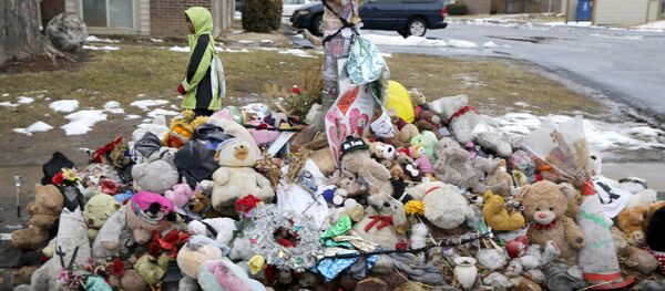 A boy walks past a memorial for Michael Brown, who was shot and killed by Ferguson, Mo., Police Officer Darren Wilson last summer, Tuesday, March 3, 2015, in Ferguson A boy walks past a memorial for Michael Brown, who was shot and killed by Ferguson, Mo., Police Officer Darren Wilson last summer, Tuesday, March 3, 2015, in Ferguson - Sputnik International