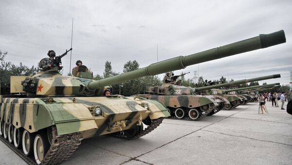 Chinese soldiers pose in tanks during a training session at the Academy of Armored Forces Engineering of the Peoples Liberation Army (PLA) in Beijing, China, 22 July 2014 - Sputnik International