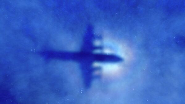 The shadow of a Royal New Zealand Air Force (RNZAF) P3 Orion maritime search aircraft can be seen on low-level clouds as it flies over the southern Indian Ocean looking for missing Malaysian Airlines flight MH370 - Sputnik International