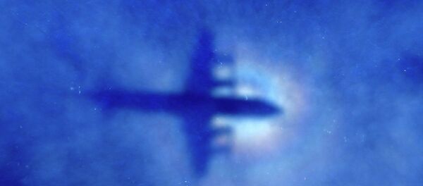The shadow of a Royal New Zealand Air Force (RNZAF) P3 Orion maritime search aircraft can be seen on low-level clouds as it flies over the southern Indian Ocean looking for missing Malaysian Airlines flight MH370 The shadow of a Royal New Zealand Air Force (RNZAF) P3 Orion maritime search aircraft can be seen on low-level clouds as it flies over the southern Indian Ocean looking for missing Malaysian Airlines flight MH370 - Sputnik International