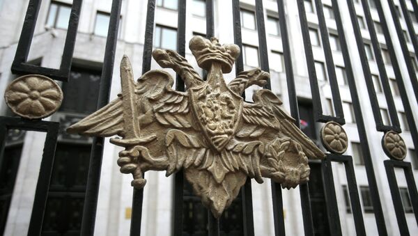 The emblem of the Russian Defense Ministry adorns the fence around the Defense Ministry's headquarters in Moscow, Russia, Thursday, Oct. 25, 2012 - Sputnik International