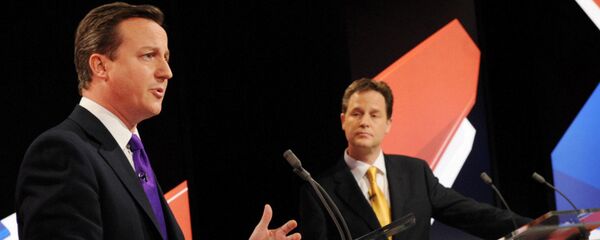 Conservative leader David Cameron, left, and Liberal Democrat Party leader Nick Clegg, centre, take part in Britain's second televised election debate in Bristol, England, Thursday, April 22, 2010. Conservative leader David Cameron, left, and Liberal Democrat Party leader Nick Clegg, centre, take part in Britain's second televised election debate in Bristol, England, Thursday, April 22, 2010. - Sputnik International