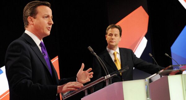 Conservative leader David Cameron, left, and Liberal Democrat Party leader Nick Clegg, centre, take part in Britain's second televised election debate in Bristol, England, Thursday, April 22, 2010. Conservative leader David Cameron, left, and Liberal Democrat Party leader Nick Clegg, centre, take part in Britain's second televised election debate in Bristol, England, Thursday, April 22, 2010. - Sputnik International