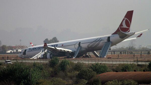 A Turkish Airlines plane lies on the field after it overshot the runway at Tribhuvan International Airport in Kathmandu March 4, 2015 - Sputnik International