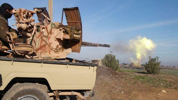In this image posted on a militant social media account by the Al-Baraka division of the Islamic State group on Tuesday, Feb. 24, 2015, a fighter fires a heavy weapon mounted on the back of a pickup truck during fighting in Tal Tamr, Hassakeh province, Syria - Sputnik International