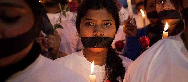 Indian women participate in a candle light vigil for Jyoti Singh Indian women participate in a candle light vigil for Jyoti Singh - Sputnik International