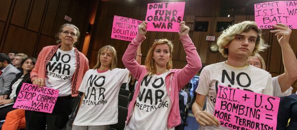 Members of the activist group CodePink gather for a Senate Armed Services Committee hearing with Defense Secretary Chuck Hagel and Army Gen Members of the activist group CodePink gather for a Senate Armed Services Committee hearing with Defense Secretary Chuck Hagel and Army Gen - Sputnik International