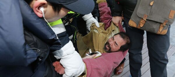 Security personnel detain Kim Ki-jong, a member of a pro-Korean unification group who attacked the US ambassador to South Korea Mark Lippert at a public forum, in central Seoul March 5, 2015 Security personnel detain Kim Ki-jong, a member of a pro-Korean unification group who attacked the US ambassador to South Korea Mark Lippert at a public forum, in central Seoul March 5, 2015 - Sputnik International