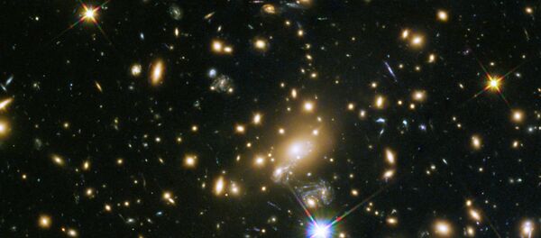 An example of a galaxy cluster: the galaxy cluster MACS J1149.5+223, whose light took over 5 billion years to reach us. - Sputnik International